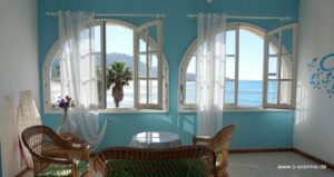 Portixeddu, Sabbia Bianca: Zimmer mit Bogenfenstern und Meerblick